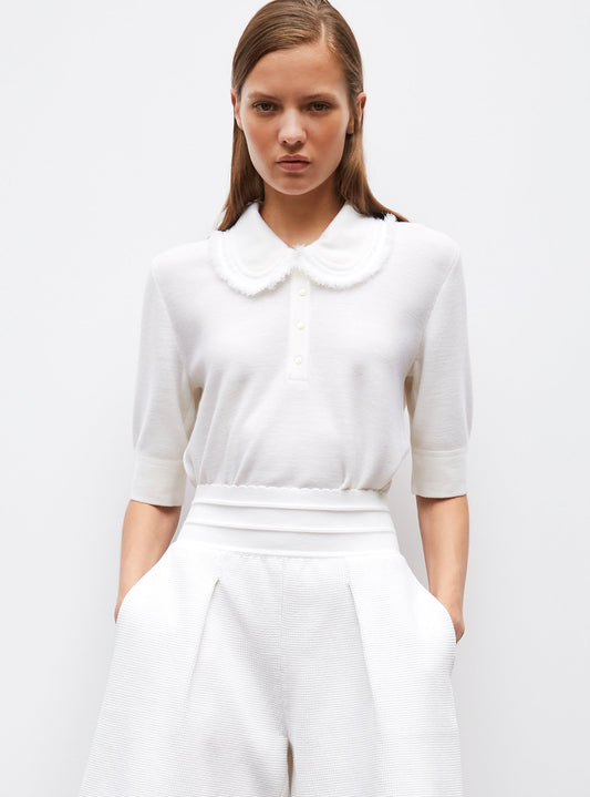 top en maille à col frangé